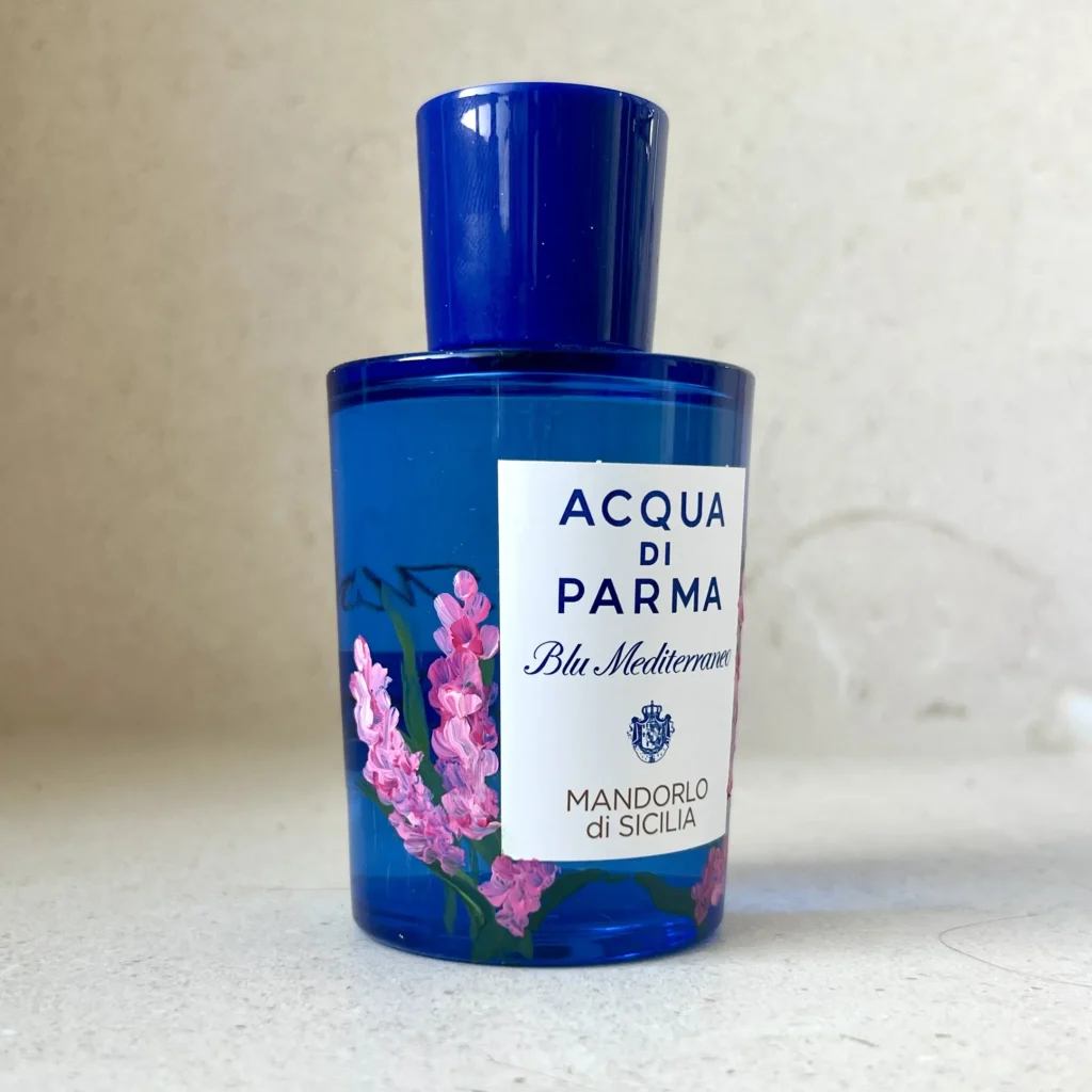 Bottle-Painting-pink-flowers-on-perfume Pink Fowers on a blue perfume bottle Acqua di Parma hand painted live