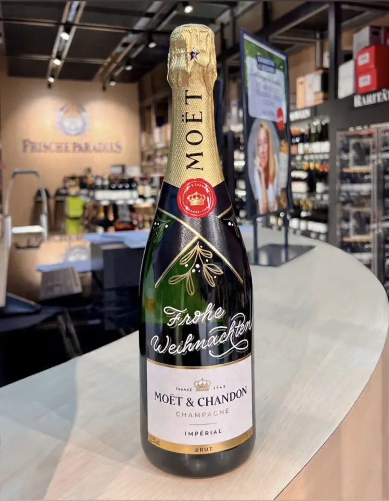 Champagner mit Beschriftung Frohe Weihnachten